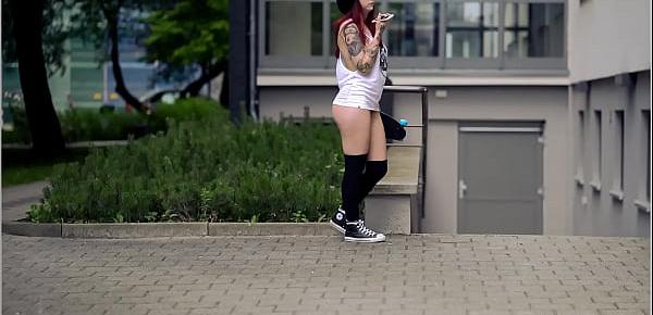  Brunette girl with skateboard flashing in public